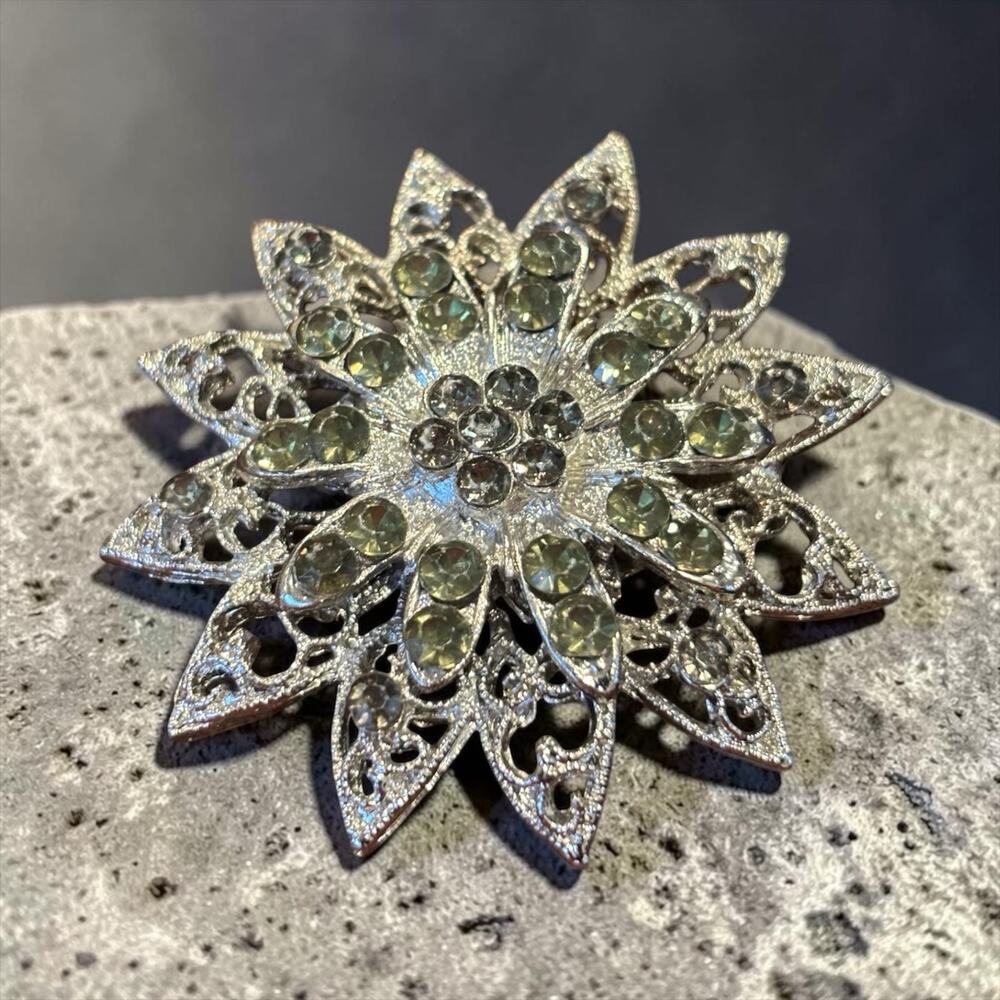 Aurora Rhinestone Snowflake Brooch 1950s Silver Tone Filigree Starburst Pin